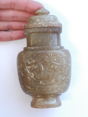 Lot 510 - A SMALL CHINESE PALE CELADON JADE VASE AND COVER.