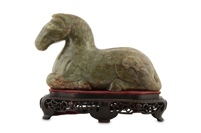 Lot 662 - A CHINESE PALE CELADON JADE CARVING OF A HORSE.
