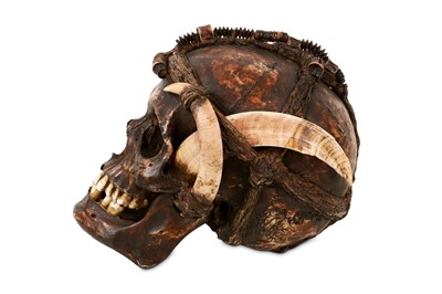 Lot 2 - TRIBAL: A DAYAK ANCESTOR HUMAN SKULL DECORATED WITH BOAR TUSKS