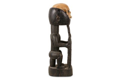 Lot 6 - TRIBAL INTEREST: A DAYAK HUMAN SKULL TROPHY ON LATER STAND