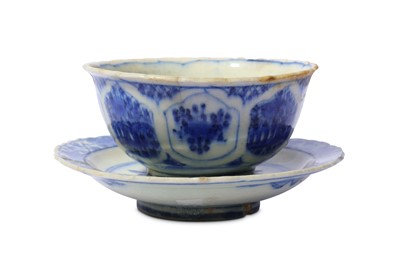 Lot 18 - * A BLUE AND WHITE POTTERY BOWL WITH SAUCER