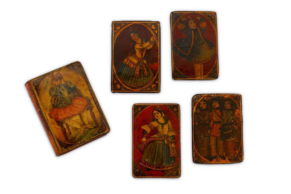 Lot 54 - * FOUR QAJAR LACQUERED PAPIER-MÂCHÉ PLAYING CARDS AND CASE