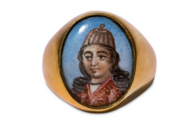 Lot 95 - * A GOLD RING WITH A POLYCHROME-PAINTED ENAMEL PORTRAIT OF A QAJAR YOUTH