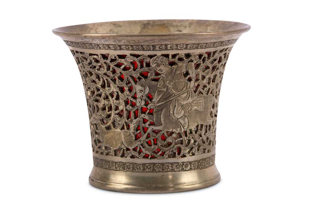 Lot 81 - * A PIERCED AND ENGRAVED SILVER QALYAN CUP