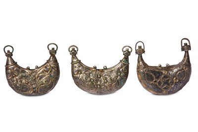 Lot 94 - * THREE SELJUK SILVER AND NIELLO PECTORAL AMULET CASES