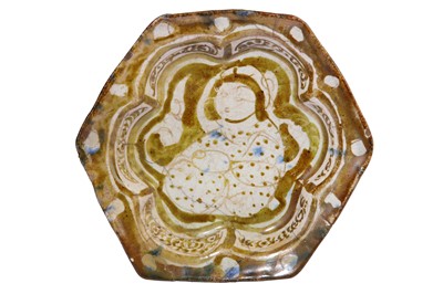 Lot 7 - * A SMALL COPPER-LUSTRE AND COBALT BLUE FOOTED POTTERY DISH