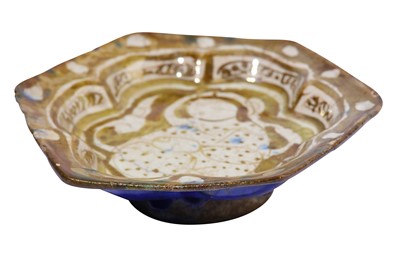 Lot 7 - * A SMALL COPPER-LUSTRE AND COBALT BLUE FOOTED POTTERY DISH