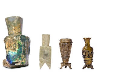 Lot 4 - * FOUR SMALL EARLY ISLAMIC GLASS OINTMENT FLASKS AND A MISFIRED BOTTLE
