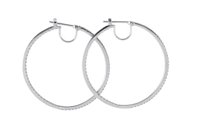 Lot 91 - A pair of diamond earrings