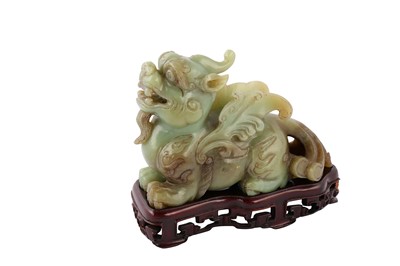 Lot 517 - A CHINESE CELADON JADE 'BIXIE' CARVING AND A CELADON JADE RHYTON