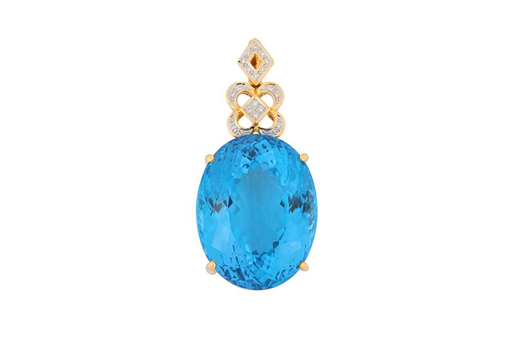 Lot 28 - A blue topaz and diamond pendant