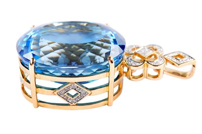 Lot 28 - A blue topaz and diamond pendant