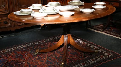 Lot 276 - An oval breakfast table on a pedestal with...