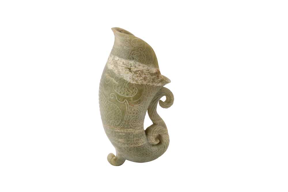 Lot 242 - A Chinese jade rhyton.