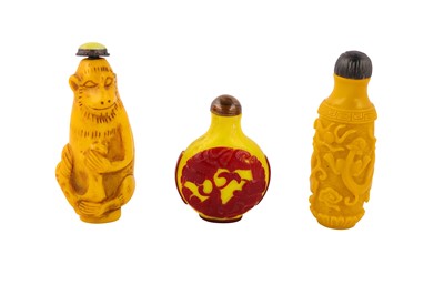 Lot 225 - A collection of three Chinese yellow Peking glass snuff bottles.