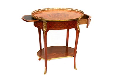 Lot 795 - An early 20th Century French walnut etagere of oval form