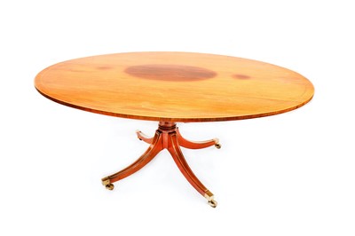 Lot 779 - A Regency style rosewood oval tilt top breakfast table