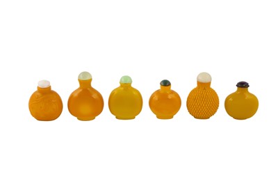 Lot 232 - A collection of six Chinese yellow Peking glass snuff bottles.