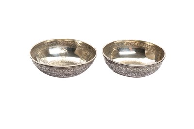 Lot 364 - A NEAR PAIR OF ENGRAVED SILVER CUPS