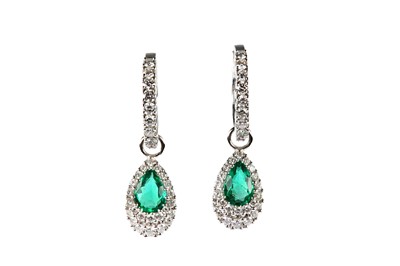 Lot 93 - A pair of emerald and diamond pendent earrings
