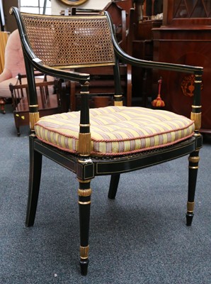 Lot 29 - A pair of Regency black painted and parcel...