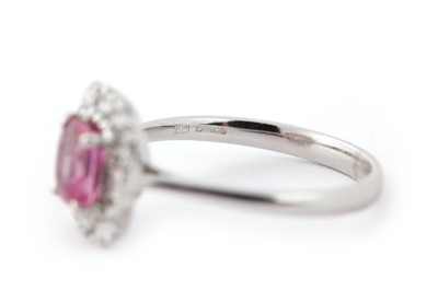 Lot 66 - A pink sapphire and diamond cluster ring