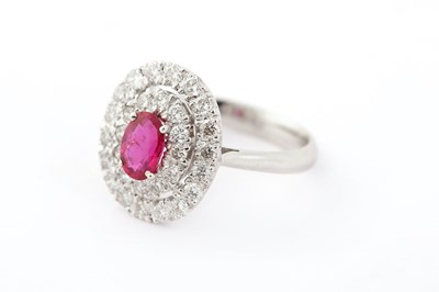 Lot 64 - A ruby and diamond target ring