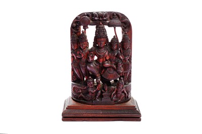 Lot 228 - A CARVED SANDALWOOD ICON OF VISHNU AND HIS CONSORT