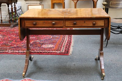 Lot 28 - A 19th Century flame mahogany sofa table with...