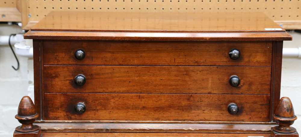 Lot 27 - A table mounted walnut chest of three specimen...