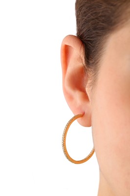 Lot 83 - A pair of diamond hoop earrings
