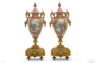 Lot 111 - A pair of 19th century Sevres style pink porcelain and bronze mounted vases