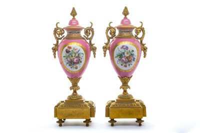 Lot 111 - A pair of 19th century Sevres style pink porcelain and bronze mounted vases