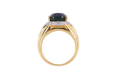 Lot 104 - A green tourmaline and diamond ring