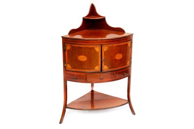 Lot 765 - A George III Sheraton design mahogany corner cabinet