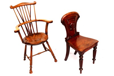 Lot 720 - A late 19th Century West Country comb back windsor armchair