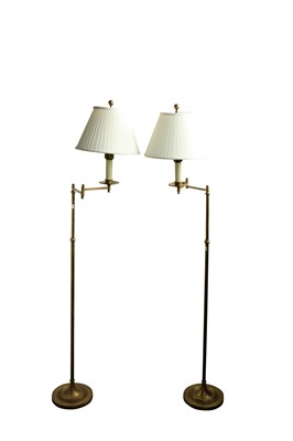 Lot 819 - A pair of adjustable brass reading standard lamps