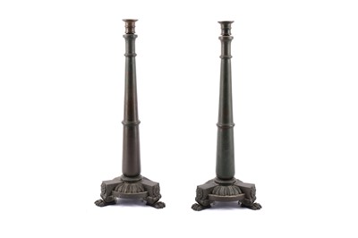 Lot 130 - A pair of Gothic style cast bronze candlesticks