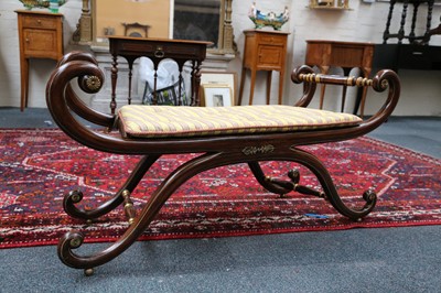 Lot 24 - A Regency simulated rosewood and parcel gilt...