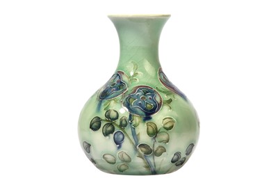 Lot 6 - WILLIAM MOORCROFT FOR LIBERTY & CO., a Tudor Rose miniature bottle vase