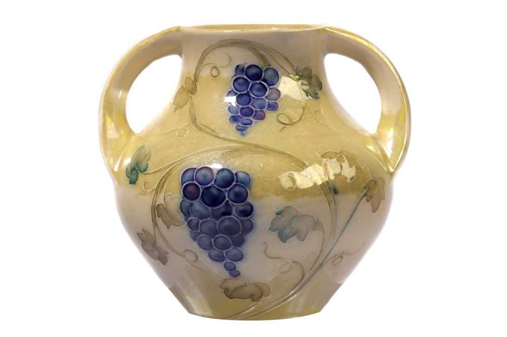 Lot 5 - WILLIAM MOORCROFT for LIBERTY & CO: a lustre two handled vase