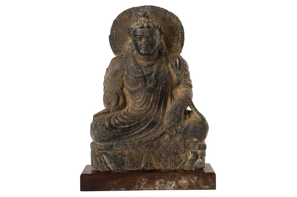 Lot 155 - A CARVED GREY SCHIST SEATED BUDDHA
