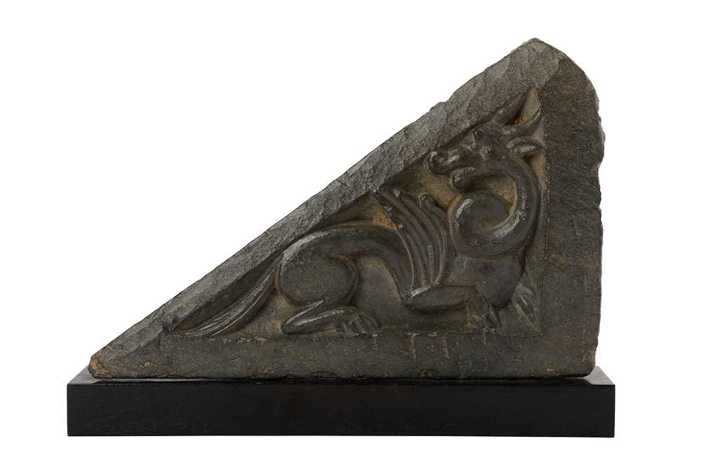 Lot 164 - A TRIANGULAR RELIEF CARVING WITH A MYTHICAL CREATURE