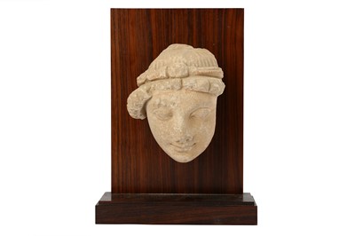 Lot 105 - A STUCCO BODHISATTVA HEAD WITH RED PIGMENT RESIDUES