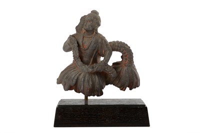 Lot 175 - A GREY SCHIST FIGURAL FRAGMENT WITH A BODHISATTVA WITH A GARLAND