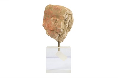 Lot 183 - A SMALL RED-PAINTED STUCCO BODHISATTVA HEAD