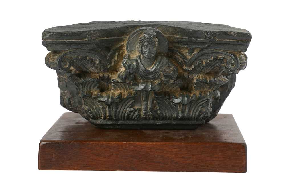 Lot 173 - A GREY SCHIST CAPITAL CARVING WITH BUDDHA IN ABHAYA MUDRA