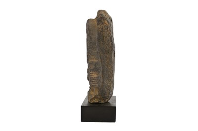 Lot 162 - A GREY SCHIST CARVING OF A FEMALE ATTENDANT UNDER AN ARCHED TORANA