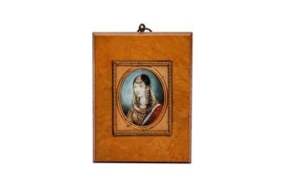 Lot 225 - λ AN INDIAN IVORY MINIATURE PORTRAIT OF A COURTLY LADY
