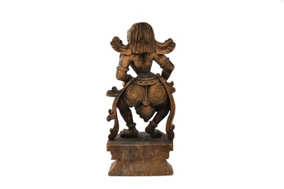 Lot 166 - A carved wooden South Indian statuette of a female musician